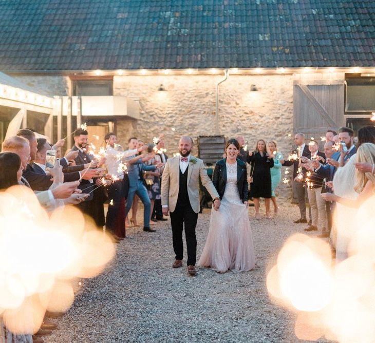 Sparkler Moment with Bride in Ombre Wedding Dress and Leather Jacket and From in Beige Blazer and Bow Tie.