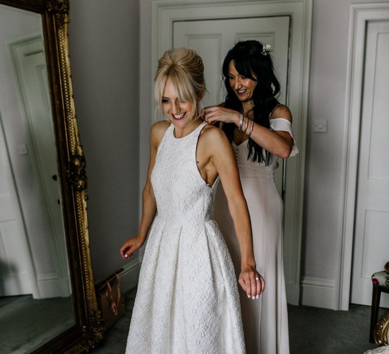 Bride Puts on Wedding Dress