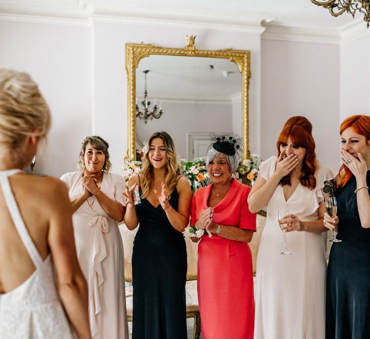 Bride Showing Bridesmaids and Family Members Backless Dress