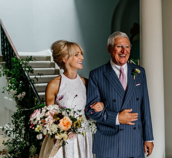 Bride and Father Prepare to Walk Down The Aisle