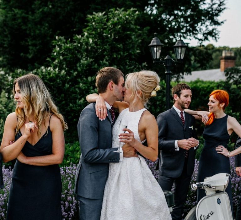 Bride and Groom Kiss In Front Of Vesper