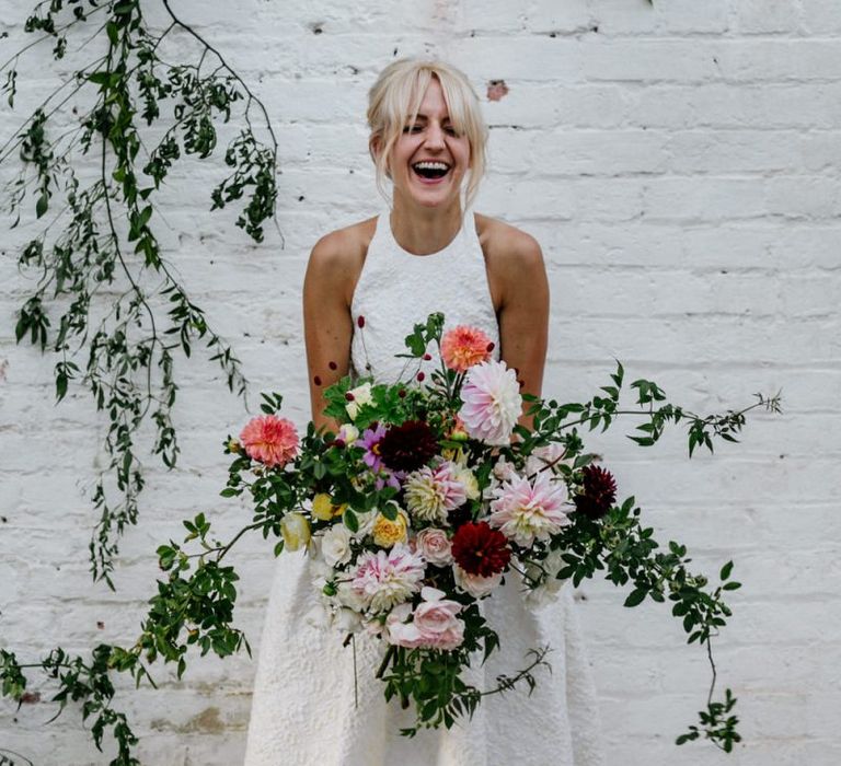 Bride Laughing Holding Beautiful Bright Bridal Bouquet