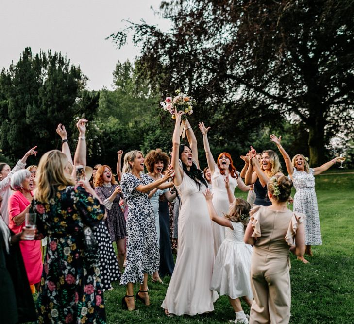 Guests Gather for Bride Bouquet Toss