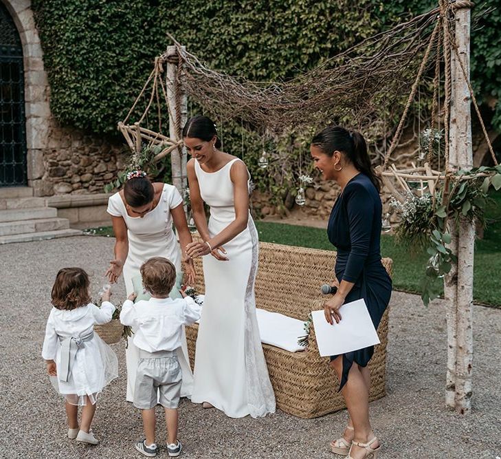 Spanish wedding with brides in fitted wedding dresses