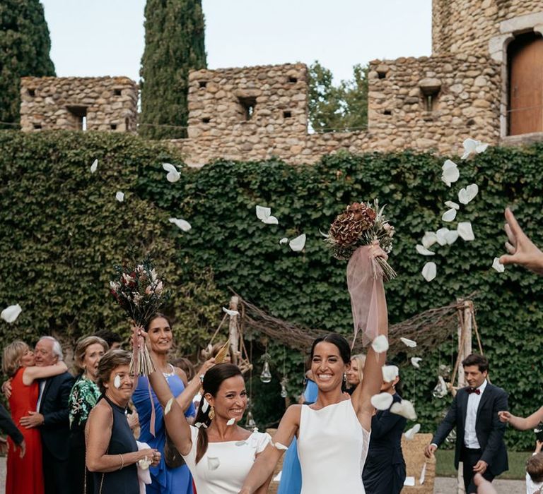 Confetti exit for brides at same-sex wedding