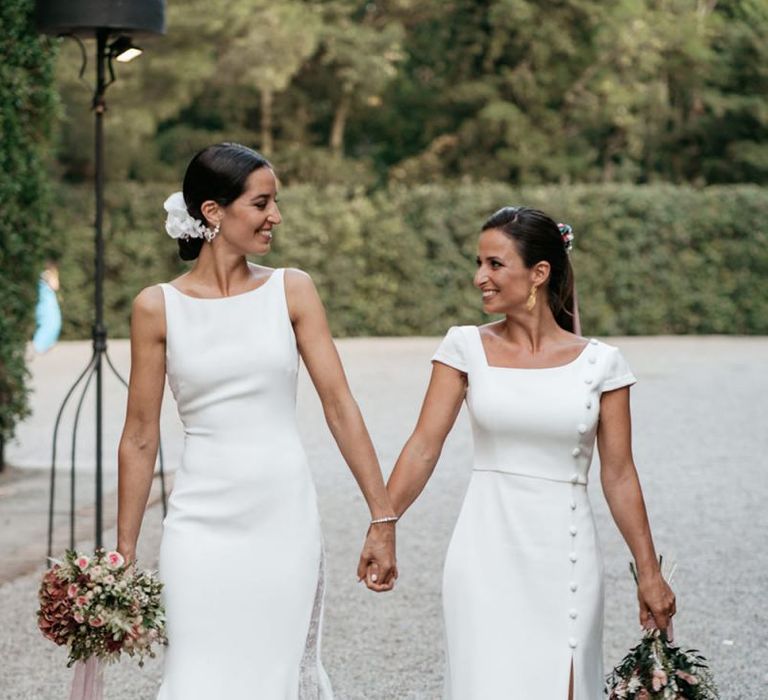 Brides in fitted wedding dresses for same-sex wedding