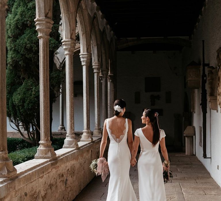 Brides in fitted wedding dresses for same-sex wedding