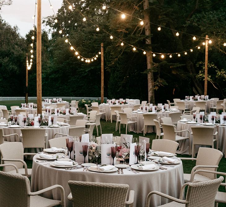 Wedding table set up with round tables and pontoon lighting