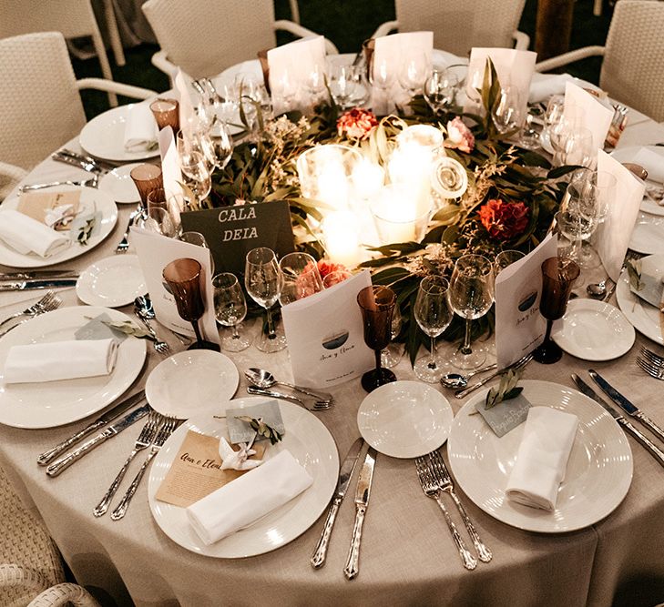 Stunning wedding table decor with flowers and candles