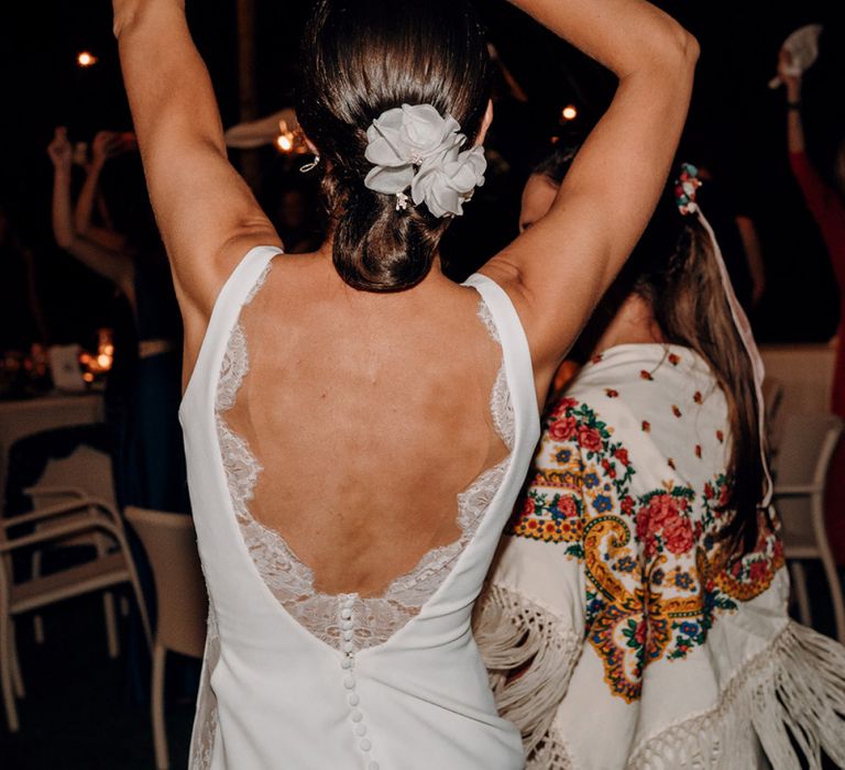 Low back lace detail fitted wedding dresses with flower hairpiece