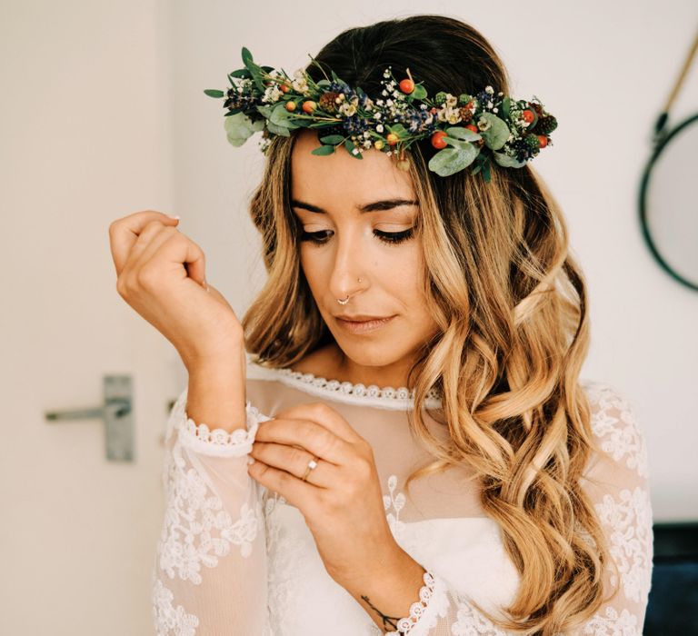 Bridal curls with flower crown at rustic wedding with globe guest book