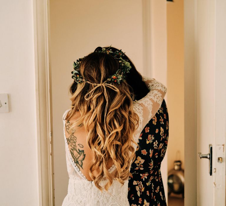 Bridal hair for rustic wedding with globe guest book