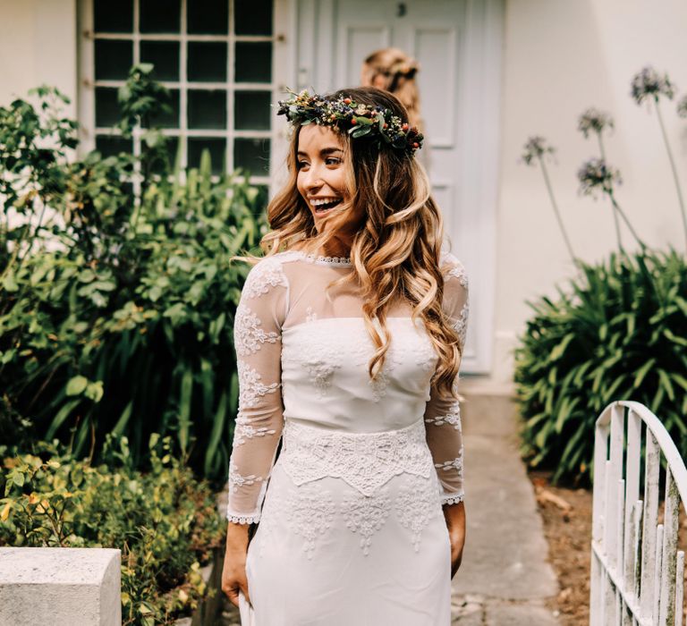 Bride in lace wedding dress with hair down