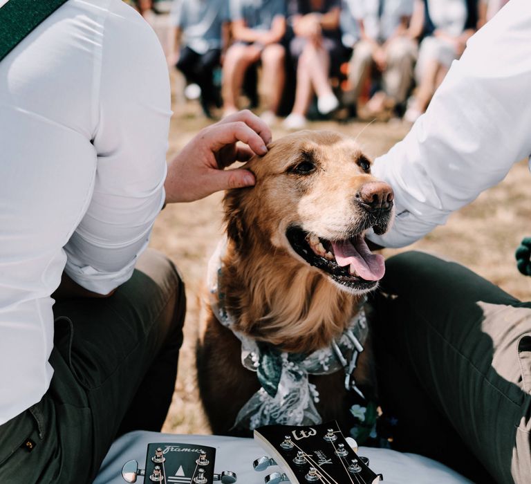 Pet dog attends rustic wedding with globe guest book