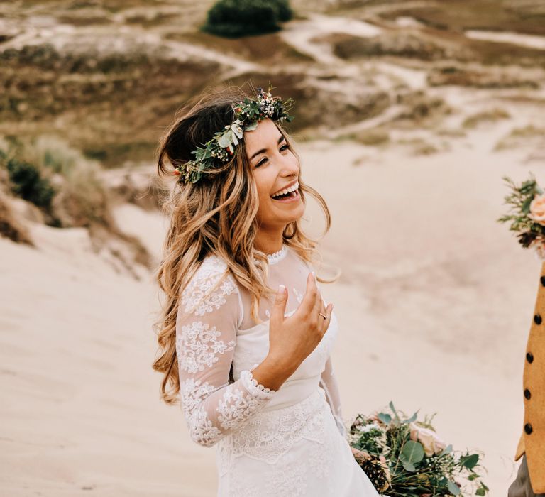 Coastal outdoor wedding with rustic decor and globe guest book