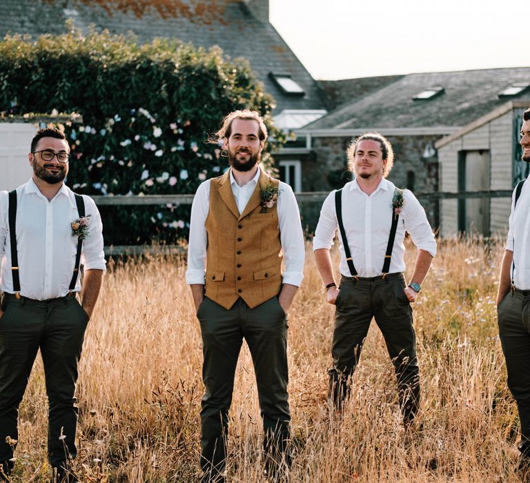 Groom and groomsmen in matching outfits