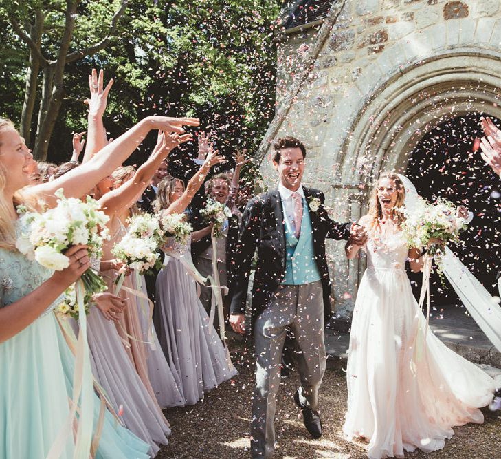 Church Confetti Exit | Bride in Bespoke Wilden London Wedding Dress | Groom in Morning Suit | Pastel Wedding at Appuldurcombe on the Isle of Wight | Maryanne Weddings Photography | Wight Weddings