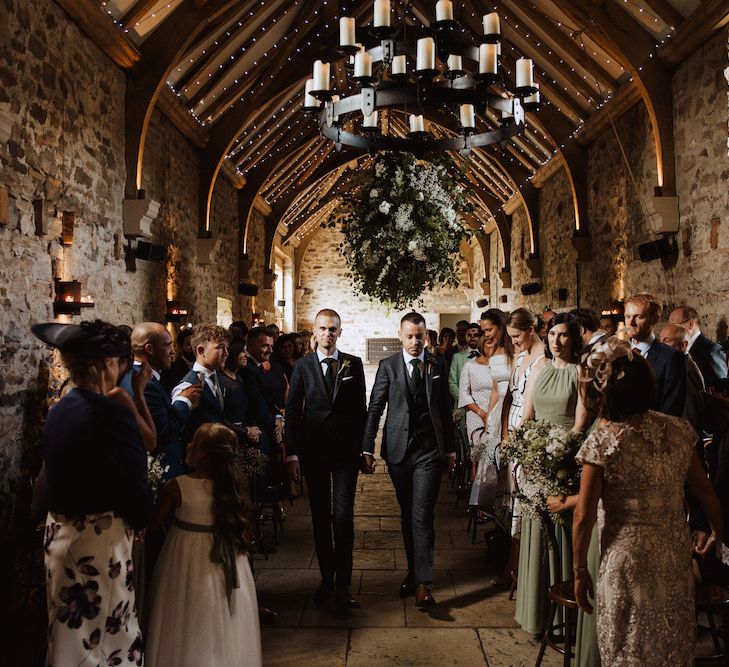 Groom and Groom Walking Down the Aisle Together at Their Gay Wedding