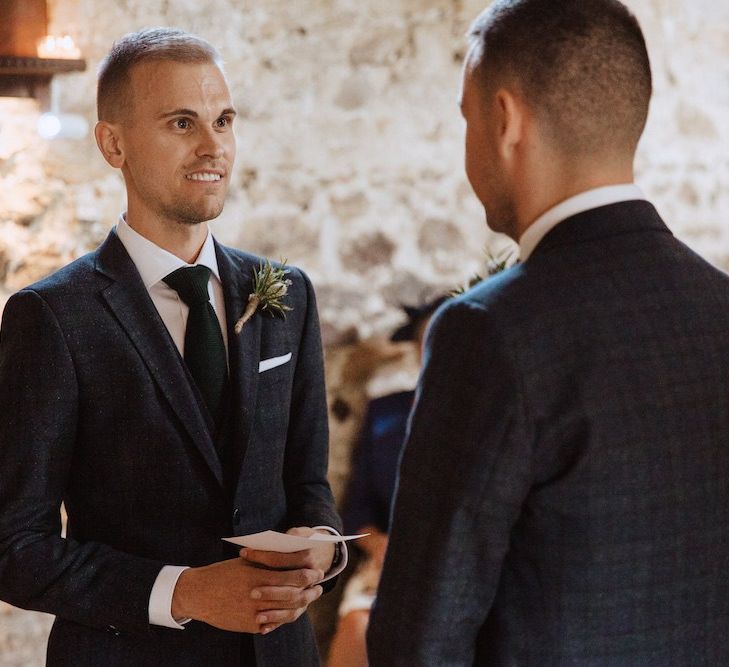 Two Grooms Exchanging Vows at Their Gay Wedding