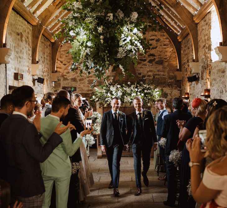 Two Grooms Walking Down the Aisle as Husband and Husband