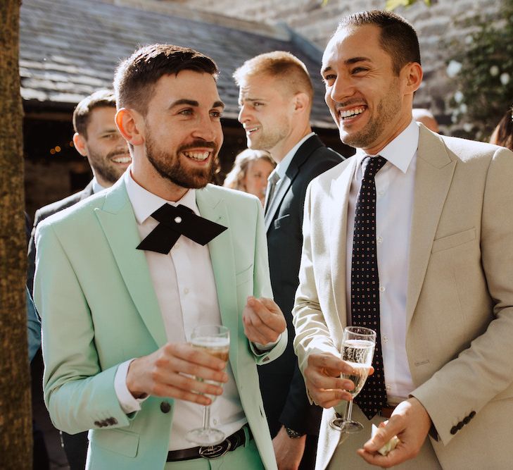 Wedding Guests in Stylish Green and Beige Suits