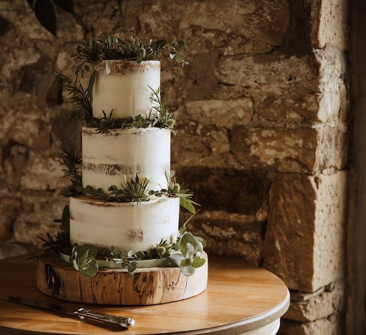 Semi Naked Wedding Cake on Tree Slice Cake Stand