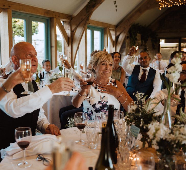 Wedding Guests Raising a Toast at the Gay Wedding