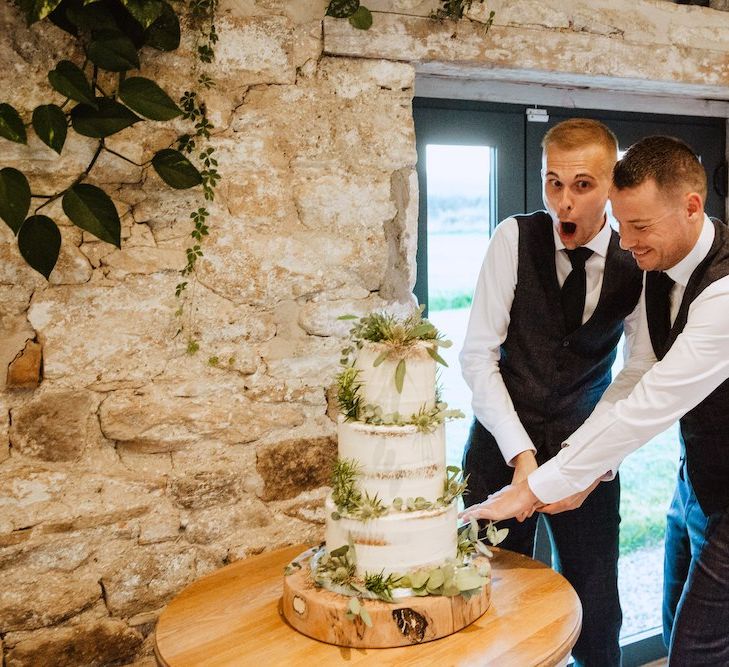 Mr &amp; Mr Cutting the Rustic Wedding Cake at Gay Wedding