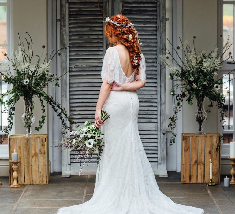 Bride Standing at the Grey Shutters Altar in Lace Wedding Dress