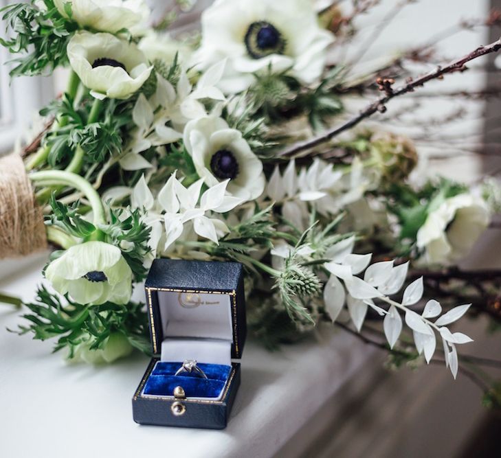 Diamond Ring Next to Anemone Bouquet