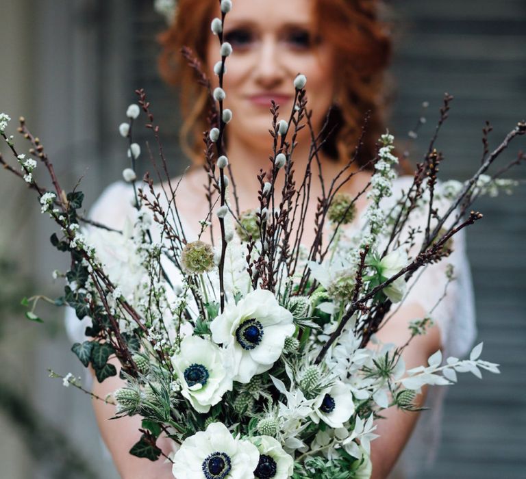 White Anemone Wedding Bouquet with Hedera Helix / Foraged English Ivy, Prunus / tightly budded cherry blossom, Eryngium Sirius Qstar Green, Bleeched Preserved Ruscus, Salix Snow Flake / Pussy Willow, Scabiosa Stellata, Spiraea /Tiny white blossom, Astilbe