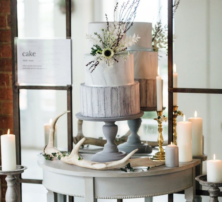 Elegant Grey and White Wedding Cake with Anemone Decor