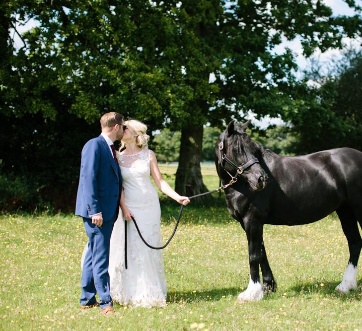 Bride in Claire Pettibone Whitney Bridal Gown with Cape | Groom in French Connection Navy Suit | DIY Country Wedding at Warborne Farm, Lymington | Camilla Arnhold Photography