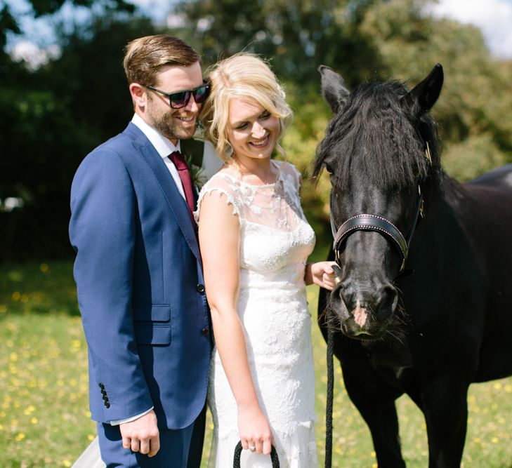 Bride in Claire Pettibone Whitney Bridal Gown with Cape | Groom in French Connection Navy Suit | DIY Country Wedding at Warborne Farm, Lymington | Camilla Arnhold Photography