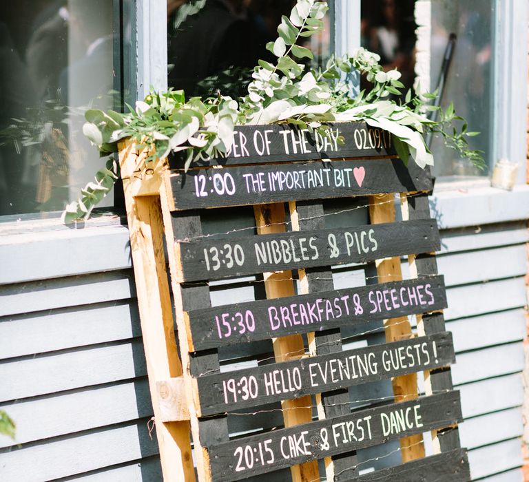 Wooden Palette Order of the Day Wedding Sign | DIY Country Wedding at Warborne Farm, Lymington | Camilla Arnhold Photography