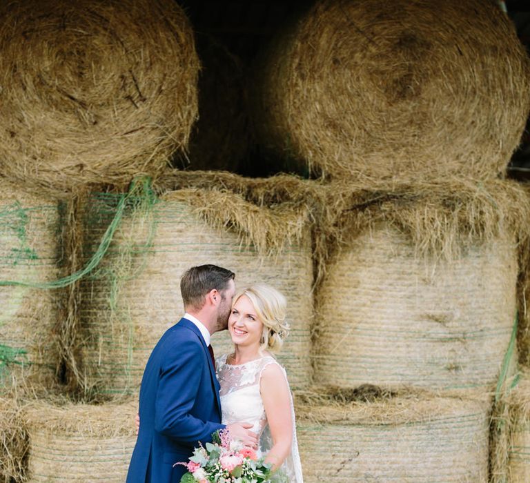 Bride in Claire Pettibone Whitney Bridal Gown with Cape | Groom in French Connection Navy Suit | DIY Country Wedding at Warborne Farm, Lymington | Camilla Arnhold Photography