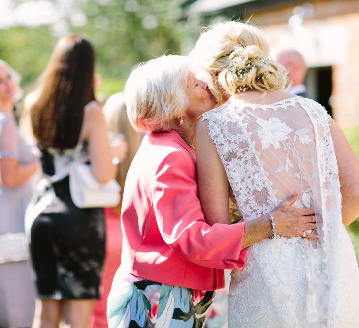 Bride in Claire Pettibone Whitney Bridal Gown with Cape | DIY Country Wedding at Warborne Farm, Lymington | Camilla Arnhold Photography