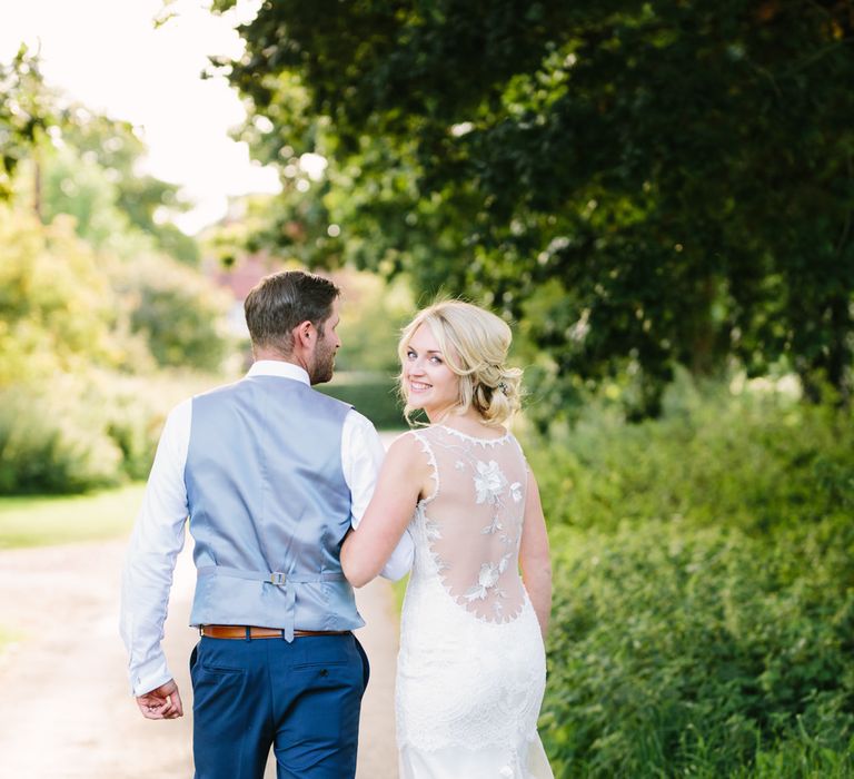 Bride in Claire Pettibone Whitney Bridal Gown with Cape | Groom in French Connection Navy Suit | DIY Country Wedding at Warborne Farm, Lymington | Camilla Arnhold Photography