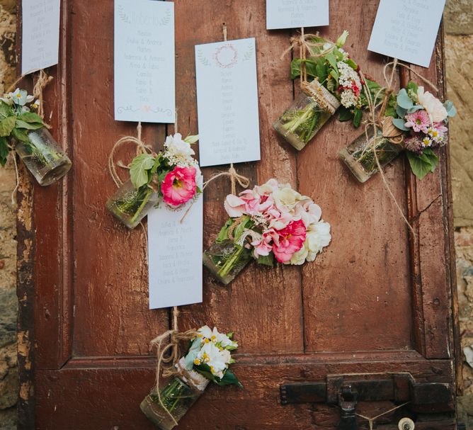 Rustic Door Table Plan with Flowers | Wedding Decor | Stylish Pink Wedding at Terzo di Danciano, Tuscany, Italy | Lucrezia Senserini Photography | Film by Righi Photography