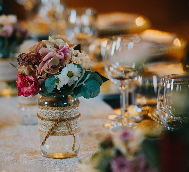 Flower Stems in Glass Jars Wedding Decor | Stylish Pink Wedding at Terzo di Danciano, Tuscany, Italy | Lucrezia Senserini Photography | Film by Righi Photography