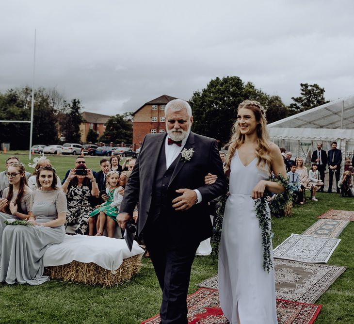 Outdoor Wedding Blessing Ceremony with Bride in Slip Wedding Dress walking Down the Aisle