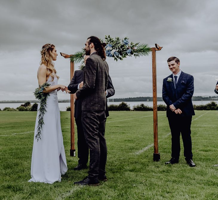 Bride and Groom Standing at the Altar of Their Outdoor Wedding Blessing