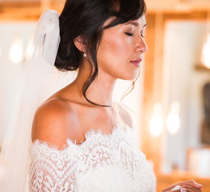 Bride in Lace Watters Dress with Bardot Neckline and Buttons Down Back | Blossom and Bluebird Cathedral Length Veil | Bridal Up Do | Smoke Bombs and Chinese Paper Fans Backdrop with Bride in Bardot Dress | Twig &amp; Vine Photography