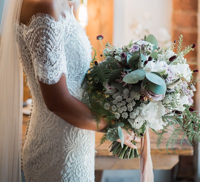 Bride in Lace Watters Dress with Bardot Neckline and Buttons Down Back | Bridal Bouquet of Dusky Pink Roses, White Peonies, Sweetpeas, Coffee-Coloured Phlox and Foliage Tied with Cappuccino Silk Ribbon | Blossom and Bluebird Cathedral Length Veil | Bridal Up Do | Smoke Bombs and Chinese Paper Fans Backdrop with Bride in Bardot Dress | Twig &amp; Vine Photography