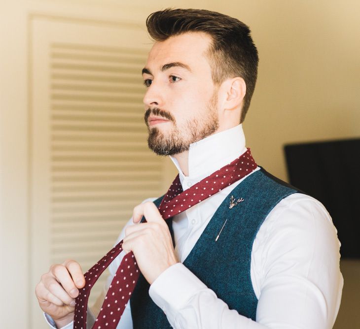 Groom Getting Ready with Tweed Waistcoat and Burgundy Tie