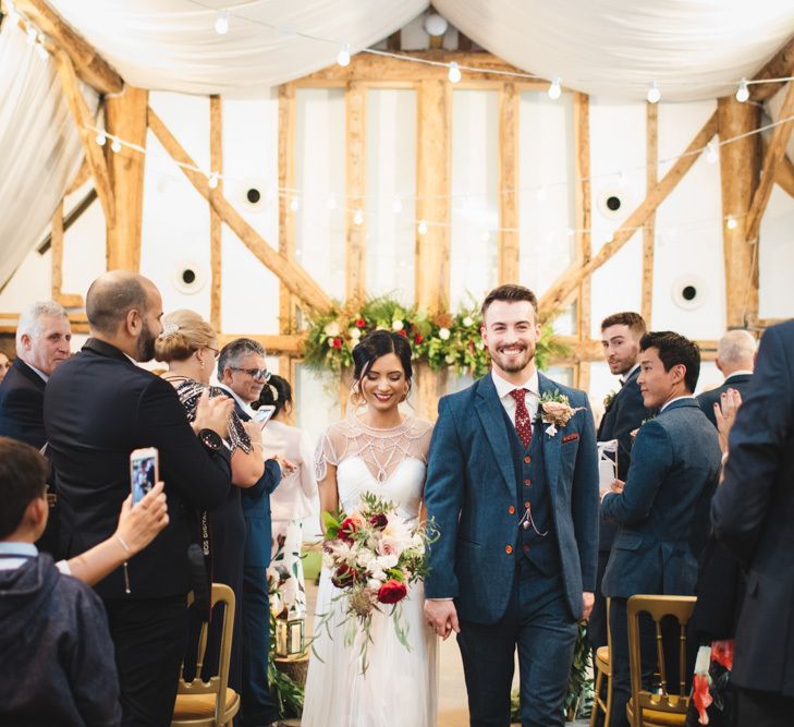 Bride and Groom Walking Down the Aisle After Ceremony