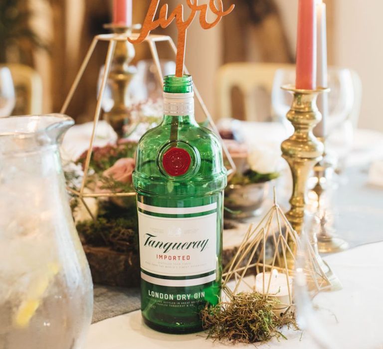 Gin Bottle Table Numbers with Candle Sticks and Candles