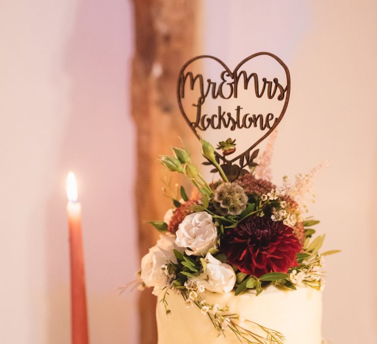 Wedding Cake Topped with Flowers and Wooden Personalised Cake Topper