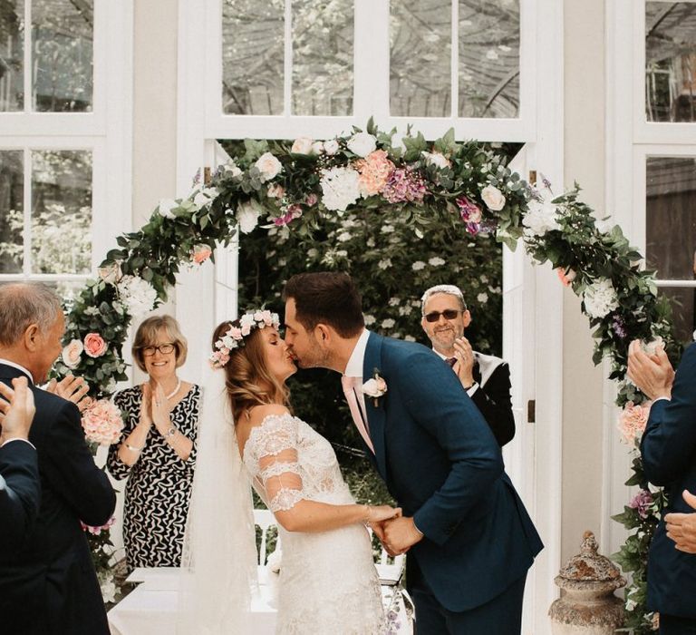 Bride and Groom Kiss During Ceremony