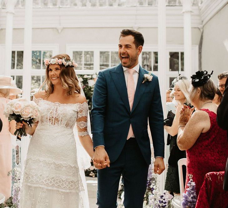 Bride and Groom Walking Down Aisle After Cermony